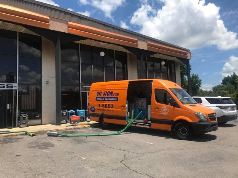 911 Restoration Disaster Restoration Van At A Commercial Job Site