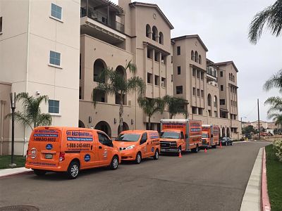 Water Restoration Vehicles at a Commercial Job Site